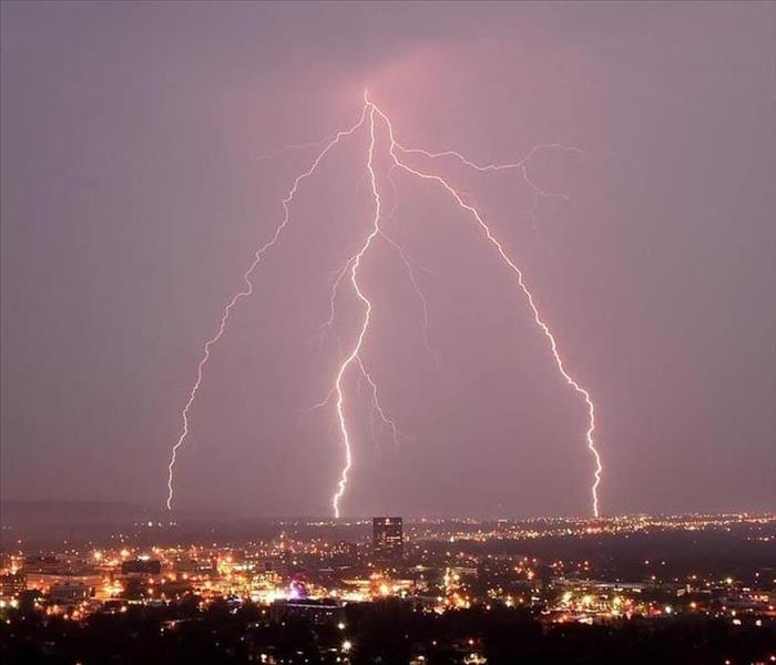 lightning strikes above a city