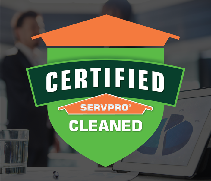 two people shaking hands with an Certified: SERVPRO Cleaned sticker over the photo